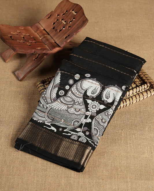 Black colour chanderi silk saree with gold zari strip pattern On body, compilmented by self colour border with antique zari pattern & white peacock print pattern and a matching blouse.