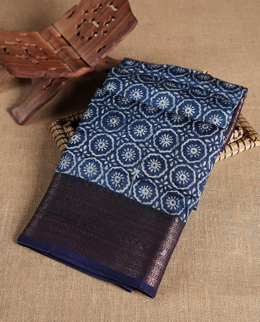 Dark blue colour chanderi silk saree with Floral block print On body, compilmented by self colour border with antique zari pattern and a matching blouse.