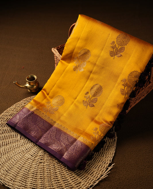 Mustard Colour Pure Banaras soft Silk Saree having gold floral motifs on Body with contrast Purple colour gold zari Border and matching Blouse