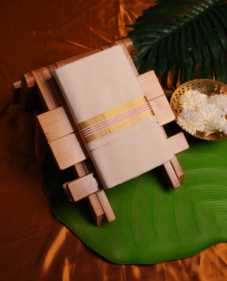 Cream colour cotton double dhoti featuring pink colour border with gold zari border