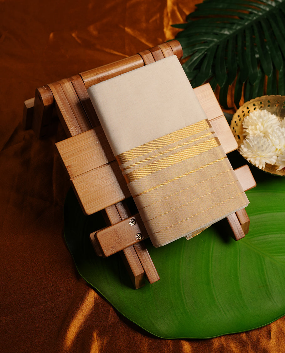 Cream colour cotton double dhoti featuring gold stripes kasavu zari border