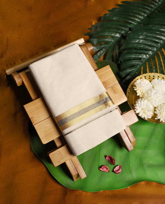 Off white colour pure handloom cotton double dhoti featuring an elegant golden zari border with fine black stripe detailing, offering a graceful and traditional look ideal for festive and cultural occasions.