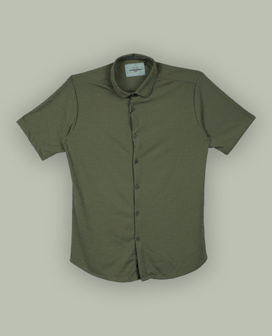 Pastel olive green colour textured shirt featuring a subtle chevron pattern, classic collar, and short sleeves & Crafted for effortless comfort and style.