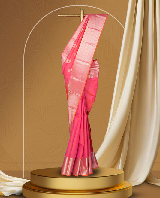 Pinkish peach colour body soft silk saree paired with a shimmering light peach & pink colour zari border & Adorned with elegant golden motifs and a matching blouse.
