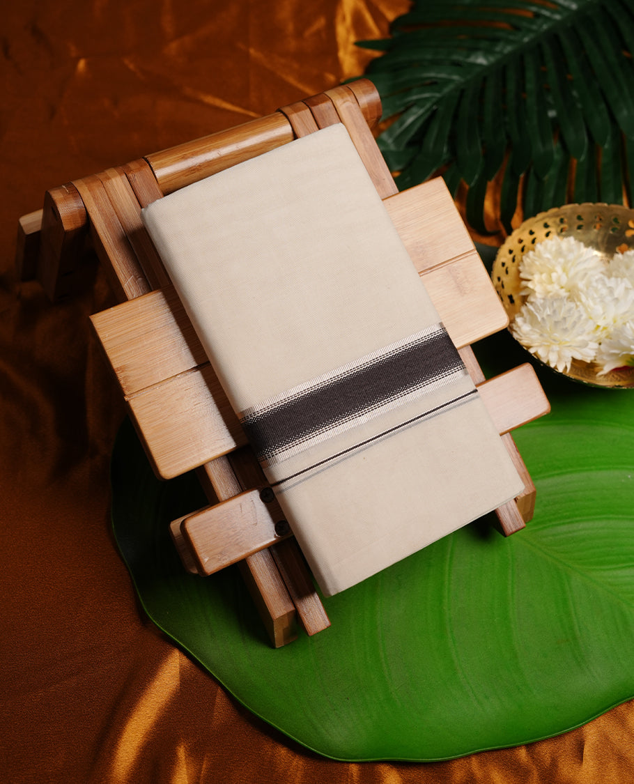 Cream colour cotton double dhoti featuring charcoal black and silver kasavu zari border