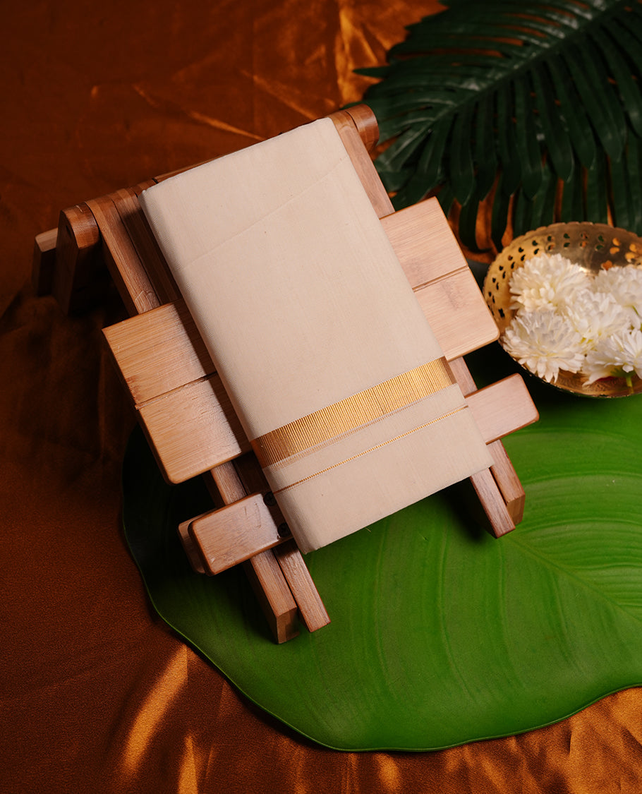 Cream colour cotton double dhoti featuring 1 inch gold kasavu zari border