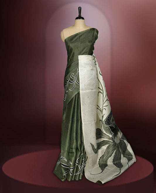 Olive green colour saree with striking off white floral patterns, merging modern minimalism with timeless charm & paired with a matching blouse.