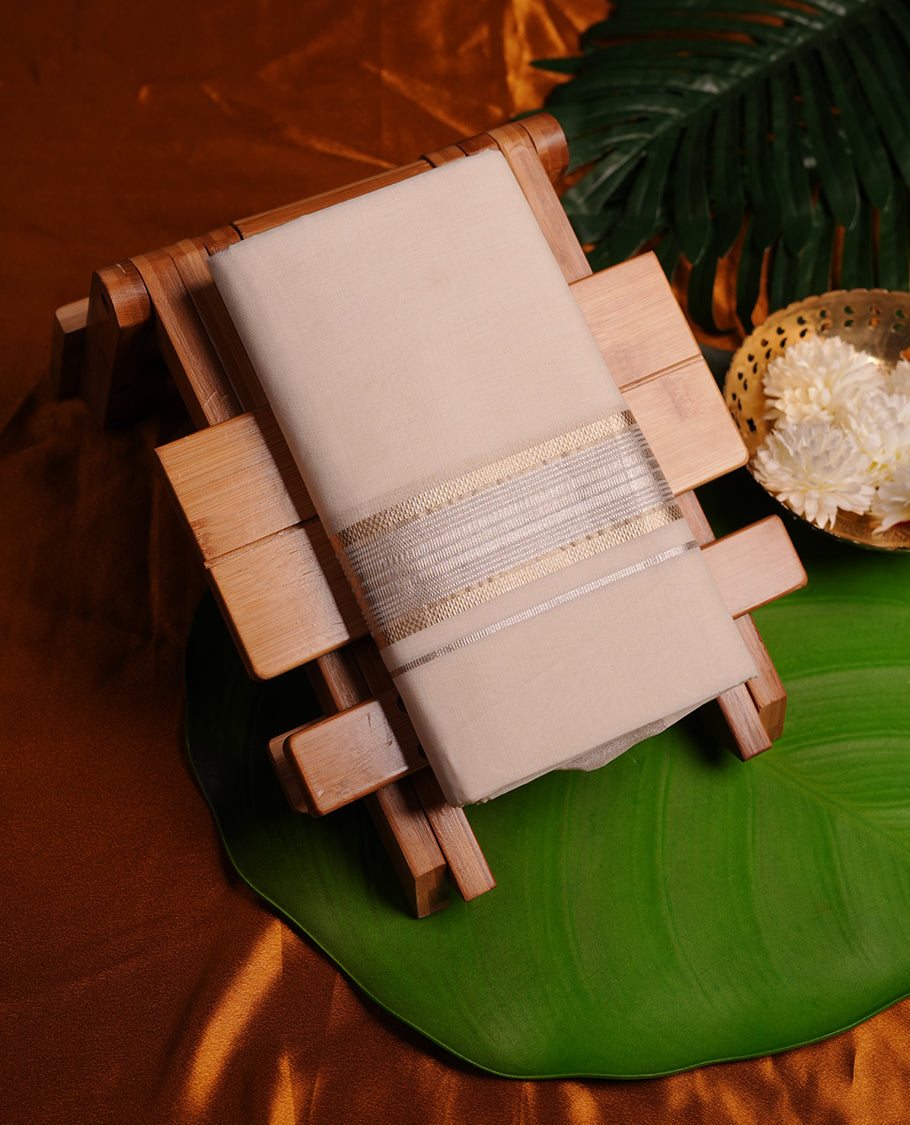 Cream colour cotton double dhoti featuring light gold and silver colour border