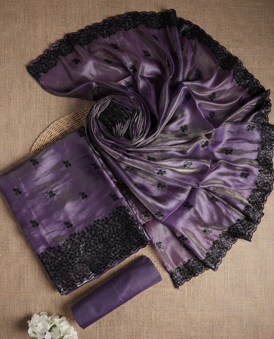 Soft purple colour dual shaded suit material featuring intricate black thread and sequin embroidery with a delicate lace border, Paired with a matching embroidered dupatta and plain bottom.