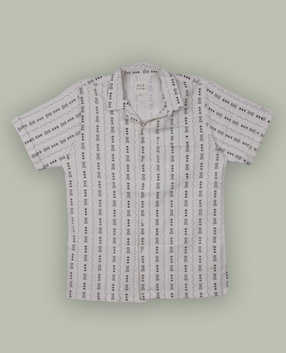 Off white colour shirt adorned with black geometric prints, Designed with a classic collar and short sleeves, it blends effortless style with everyday comfort.
