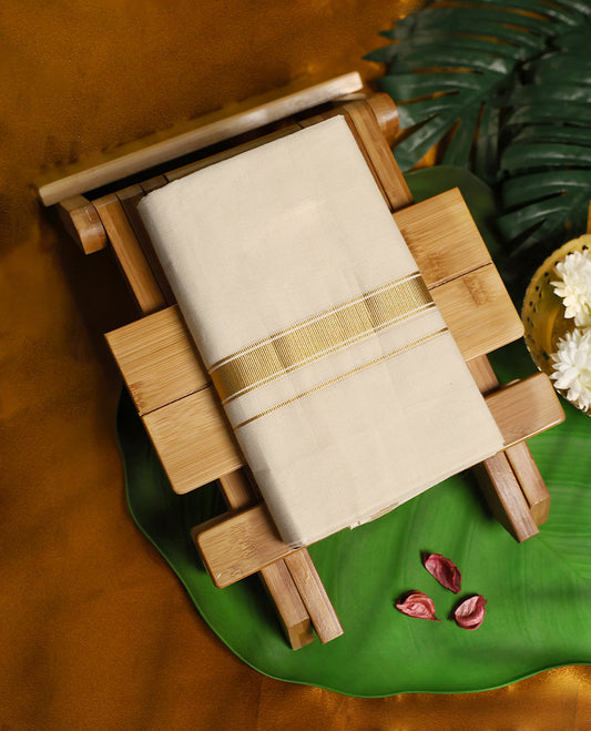 Traditional off white colour pure cotton dhoti featuring an elegant golden zari border, blending simplicity with timeless grace, making it a perfect choice for weddings, festivals, and auspicious occasions.