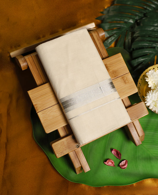 Traditional off white colour pure cotton dhoti featuring a refined silver zari border, exuding elegance and simplicity, perfect for weddings, festive rituals, and cultural occasions.