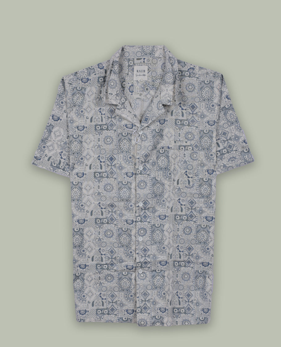 Cream colour short sleeve shirt features a rounded spread collar and a featuring an intricate blue and grey geometric tile design & its ideal for both casual days and laid back evenings.
