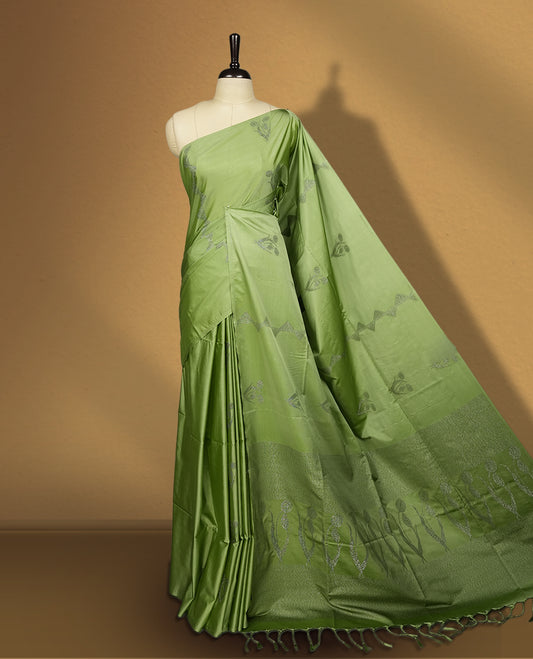 Pastel green colour semi soft silk saree adorned with delicate woven motifs on the body & Enhanced with a contrast zari border and elegant pallu with tassels, paired with a matching blouse.