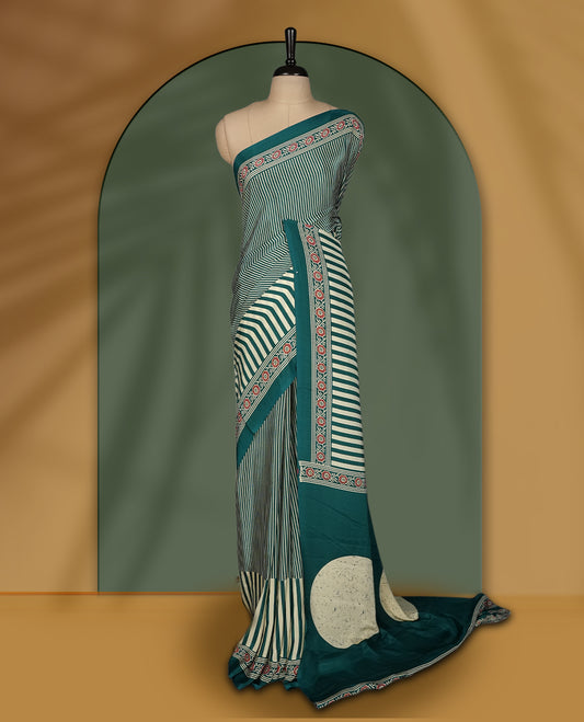 Teal and cream colour saree with bold stripes and geometric circle motifs, accentuated by a detailed ethnic border & paired with matching blouse.