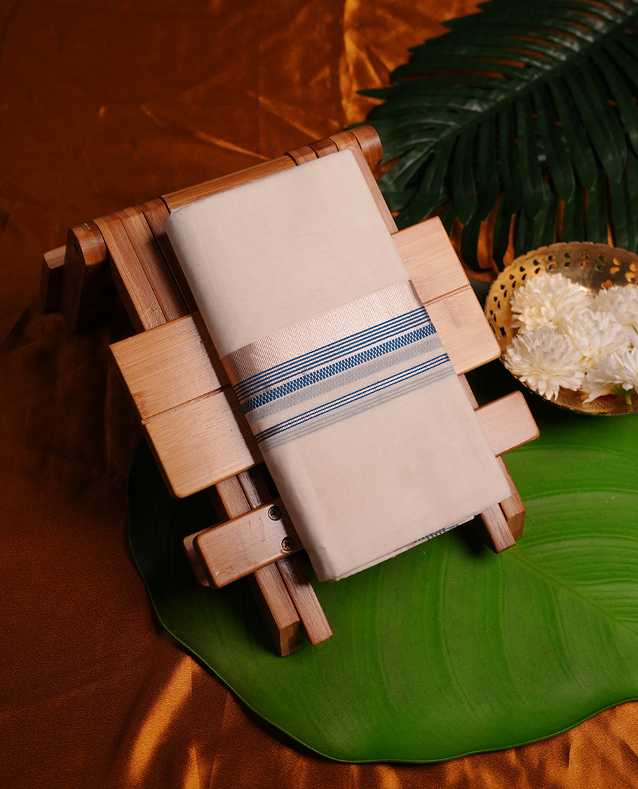Cream colour cotton double dhoti featuring blue and silver zari border