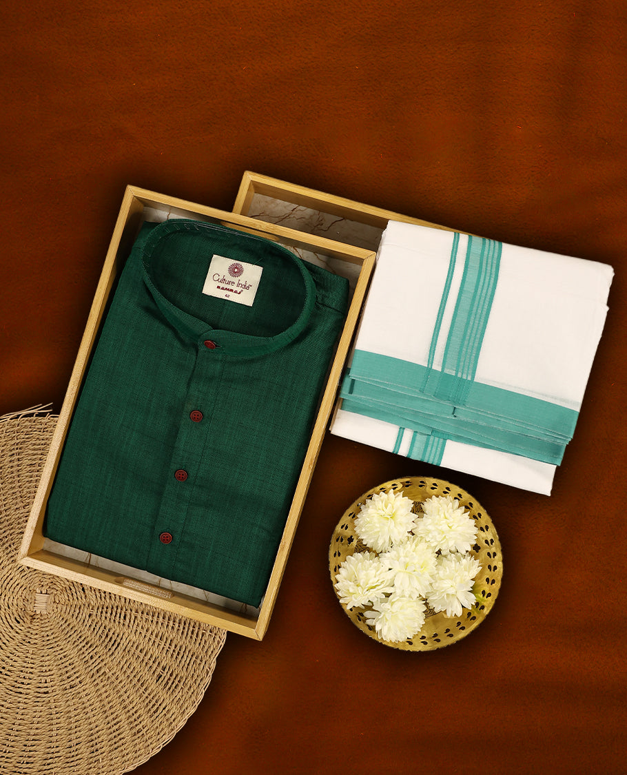 RAMRAJ Dark green kurtha paired with a white dhoti, elegantly finished with a matching dark green border.