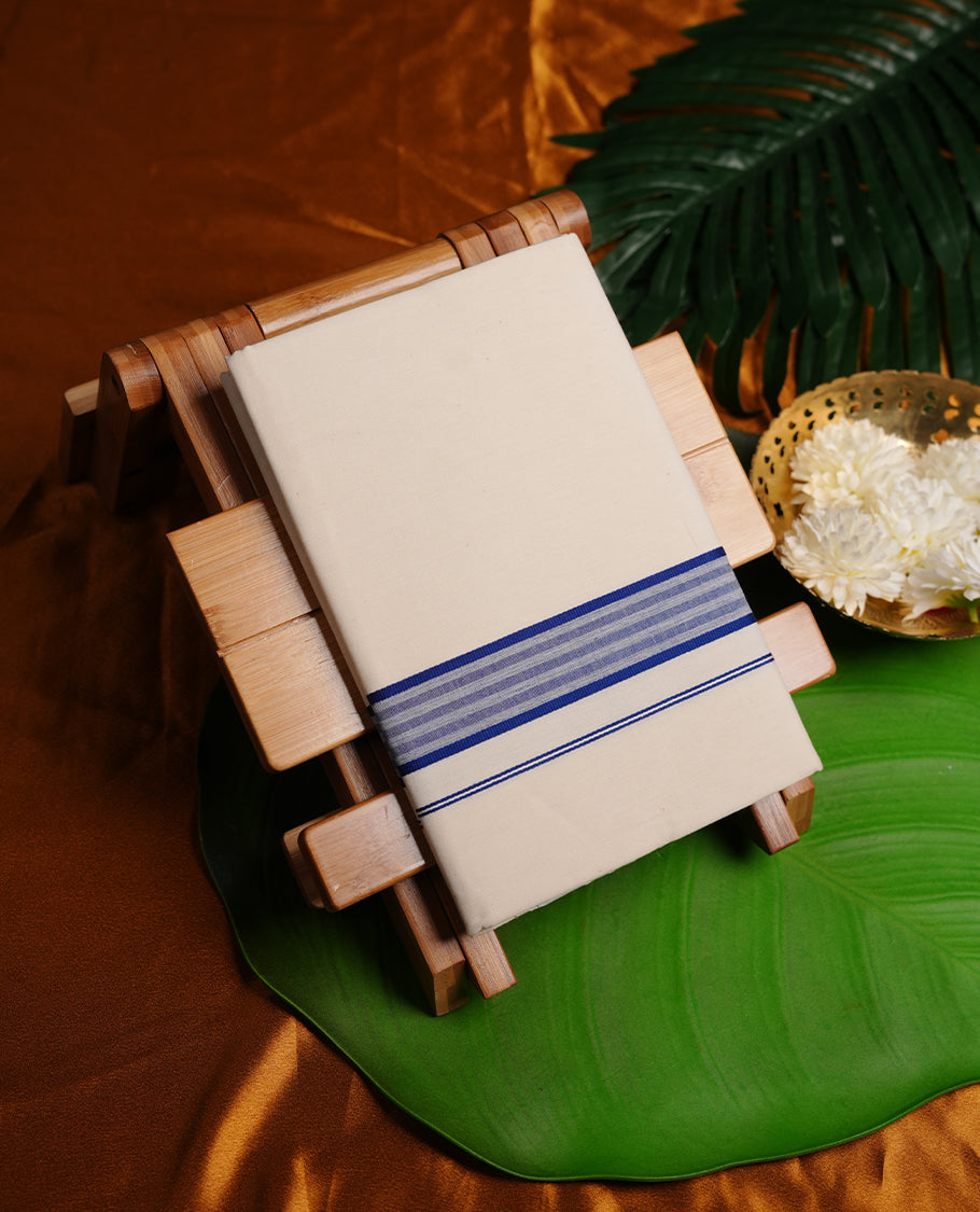 Cream colour MCR cotton single dhoti featuring navy blue colour zari border