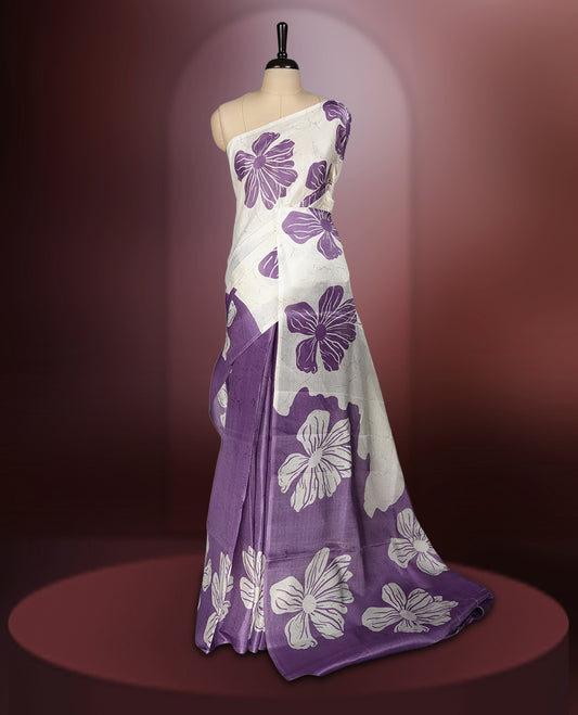 Off white colour semi khadi silk saree with light violet floral motifs and subtle , exuding timeless elegance and modern charm & paired with a matching blouse.