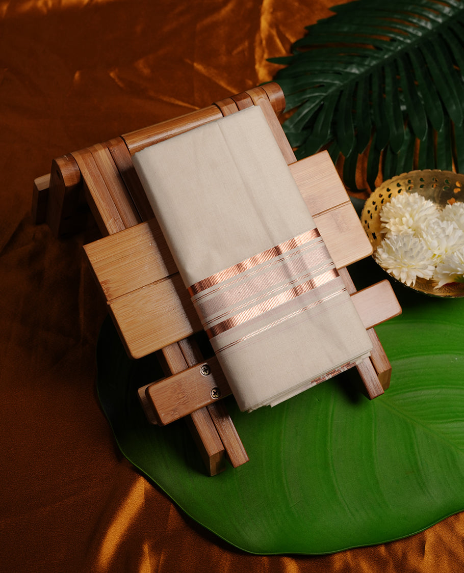 Cream colour cotton double dhoti featuring copper zari border