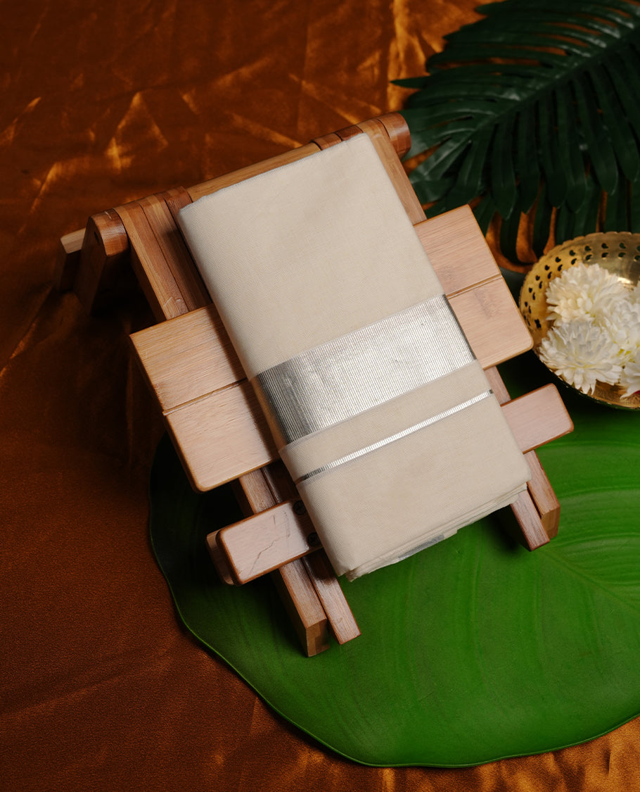 Cream colour cotton double dhoti featuring 2 inch silver kasavu zari border