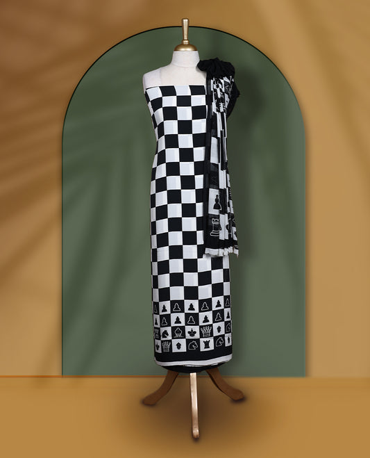 Black & white churidar set featuring a crepe top with chessboard and character prints, paired with a plain santoon bottom and a georgette dupatta adorned with chess coin prints.