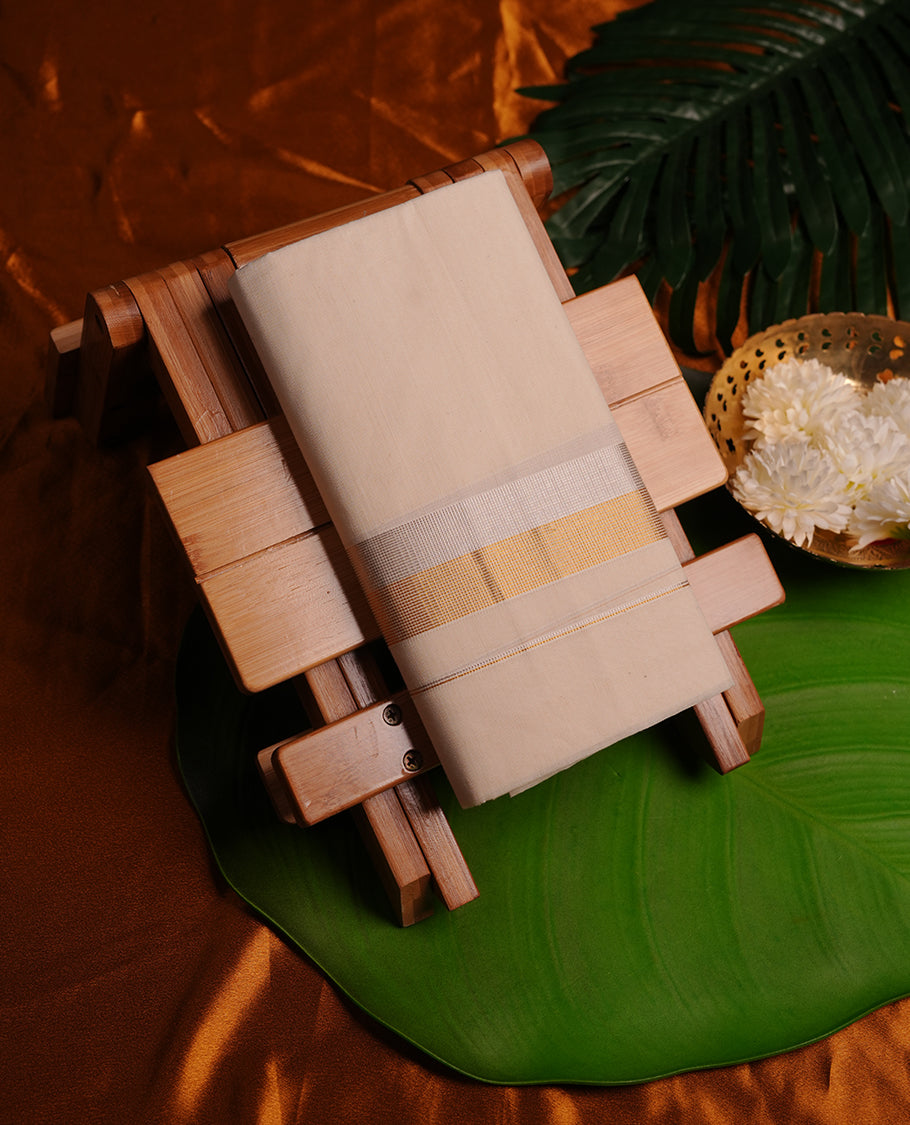 Cream colour cotton double dhoti featuring gold and silver border
