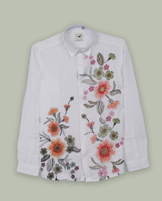 Off white colour full sleeve shirt features a rounded spread collar and a watercolor style floral print in orange, majenta, and green & its ideal for both casual days and laid back evenings.