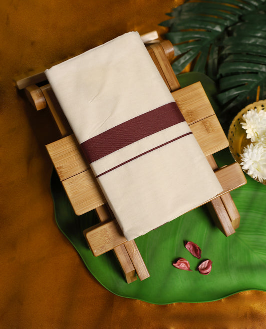 Off white cotton double dhoti enhanced with a deep maroon border and fine stripe detailing, offering a simple yet elegant traditional look perfect for daily wear, rituals, and cultural occasions.