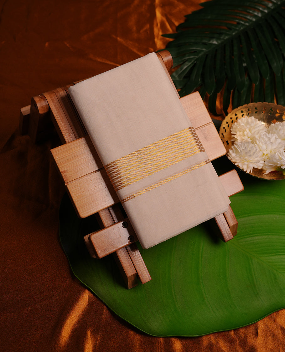 Cream colour cotton double dhoti featuring gold stripes kasavu zari border