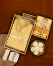 Sandal colour Aswin’s wedding set featuring a luxurious silk shirt, matching dhoti with elegant golden zari weave, paired with a towel and fragrance, crafted for weddings and festive grandeur.