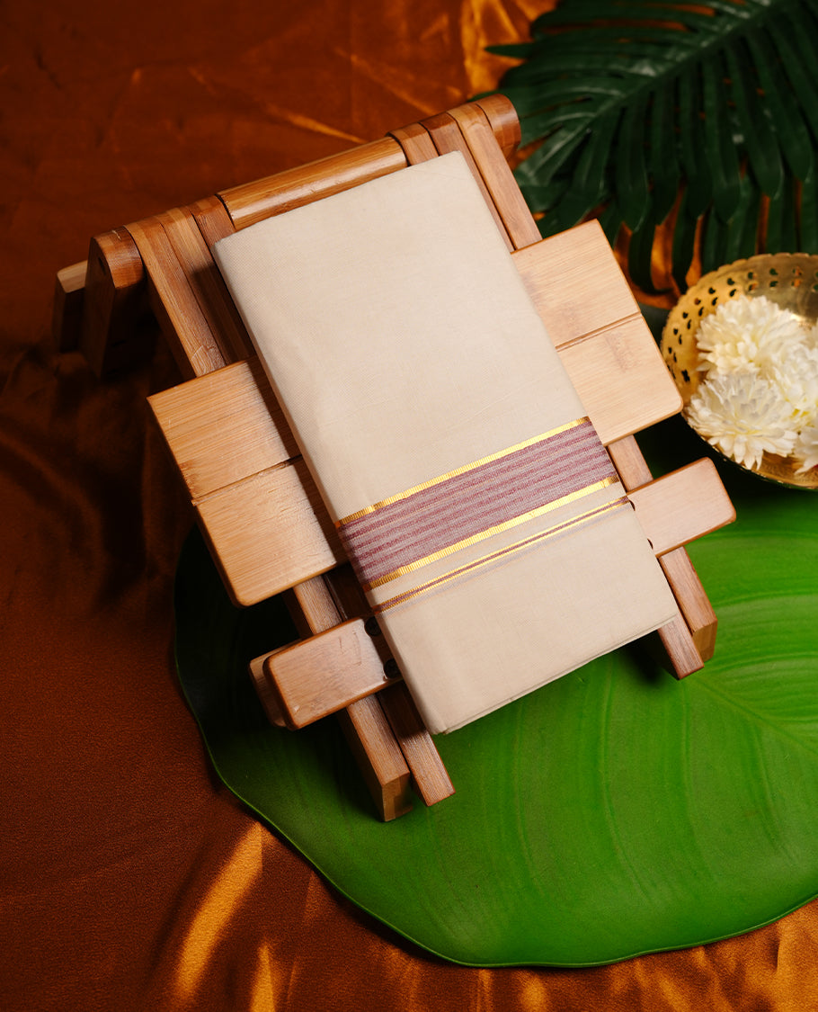 Cream colour cotton double dhoti featuring wine and gold zari border.