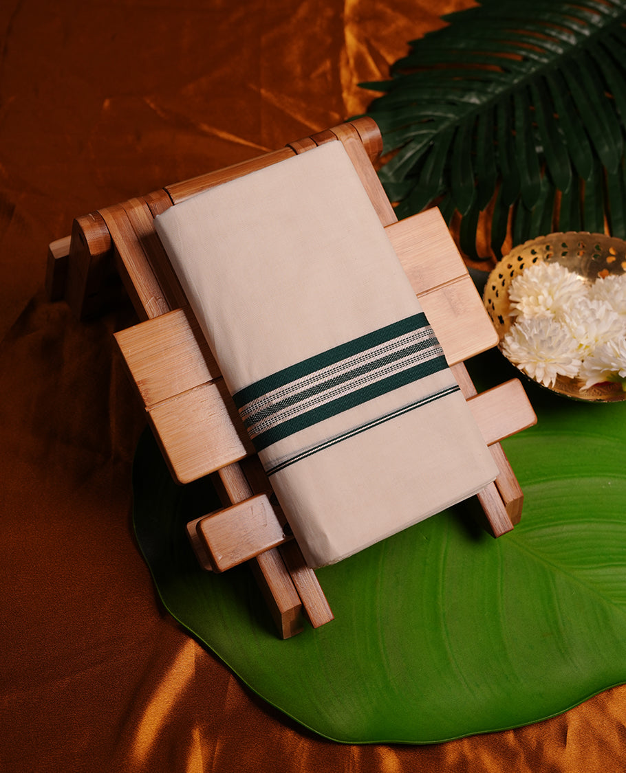 Cream colour cotton double dhoti featuring green and silver colour border