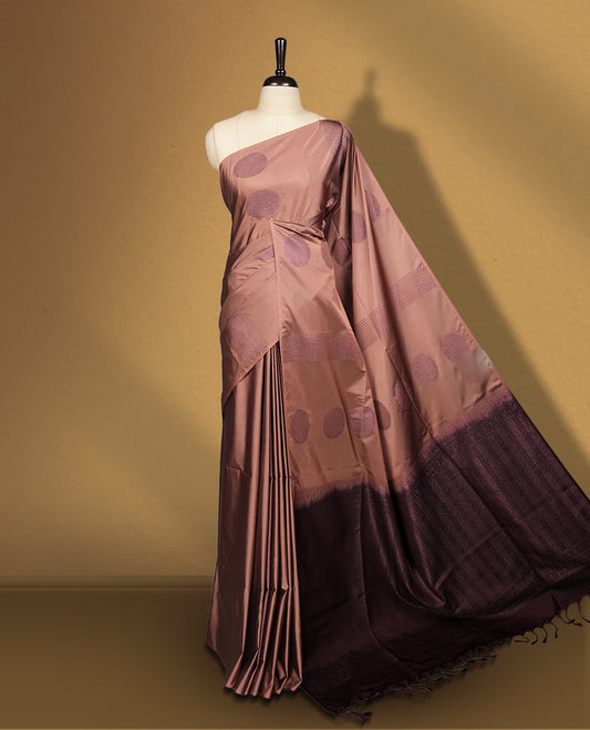 Mavue brown colour semi soft silk saree, beautifully designed with woven circular motifs & The look is enhanced by a rich contrast dark chocolate brown border and pallu, paired with a matching blouse.