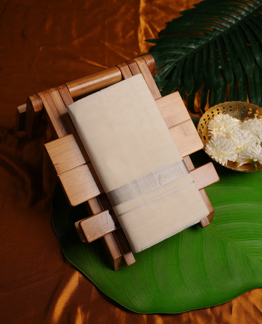 Cream colour cotton double dhoti featuring 2 inch silver kasavu zari border