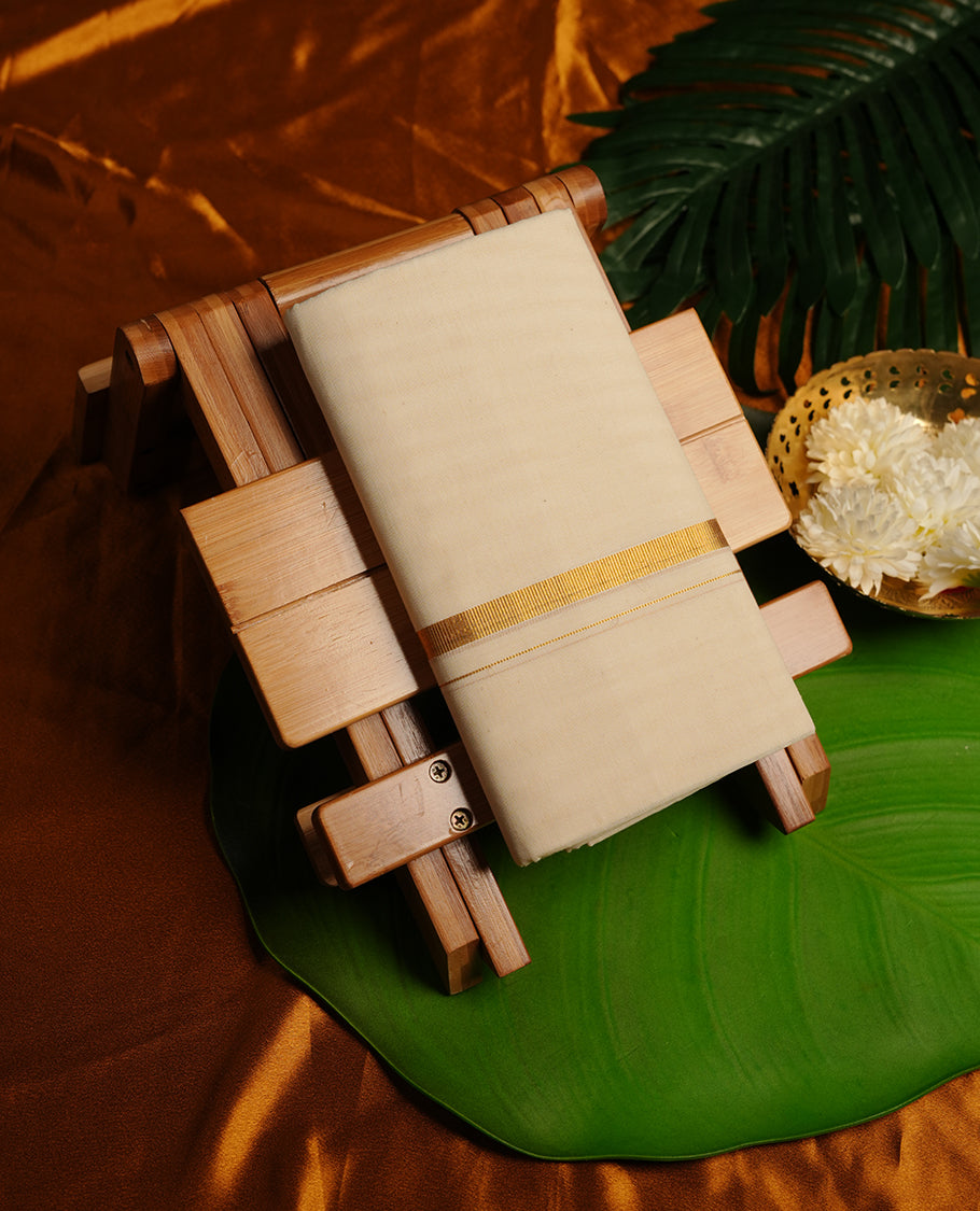 Cream colour cotton double dhoti featuring 1 inch gold kasavu zari border