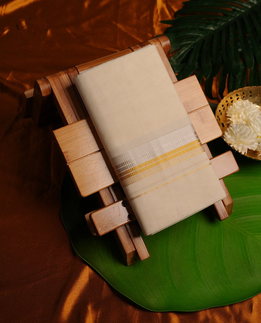 Cream colour cotton double dhoti featuring 3 inch gold and silver stripes kasavu zari border