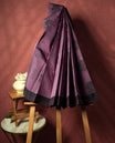 Pastel purple colour silk cotton saree featuring elegant floral zari motifs on the body, complemented by a rich contrast dark border and pallu with traditional woven detailing & Comes with a matching blouse piece.