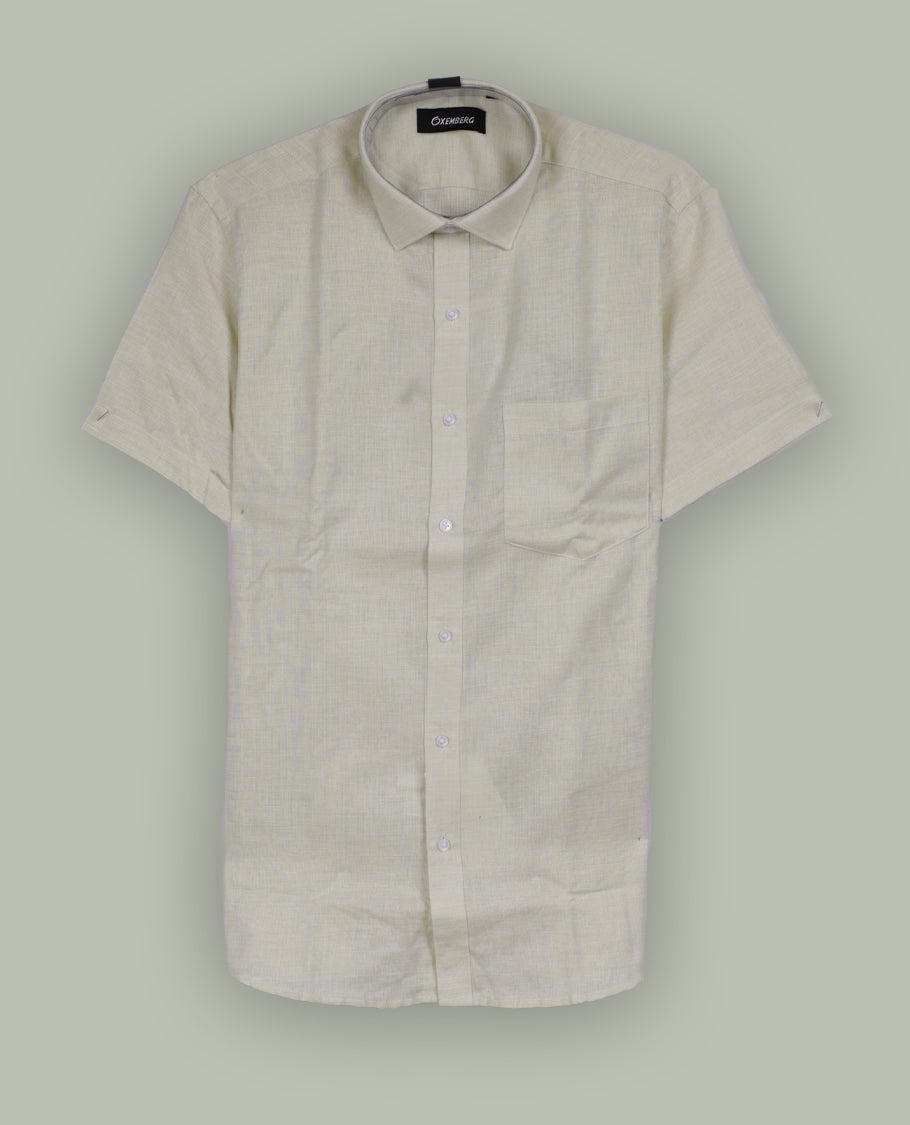 Light beige colour Oxemberg short sleeve shirt with a classic spread collar, Crafted from soft, breathable fabric, it ensures all day comfort and a smart, casual look.