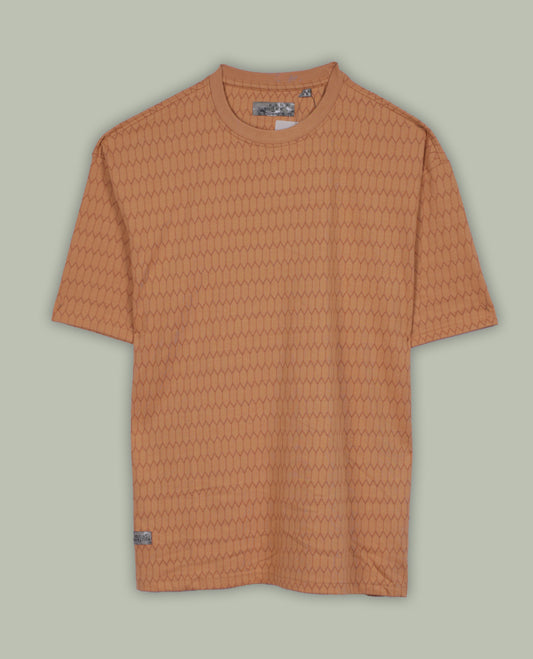 Pastel orange colour T shirt featuring a honeycomb textured pattern, designed with a classic round neck and short sleeves, made from soft breathable fabric for a relaxed and stylish everyday look.