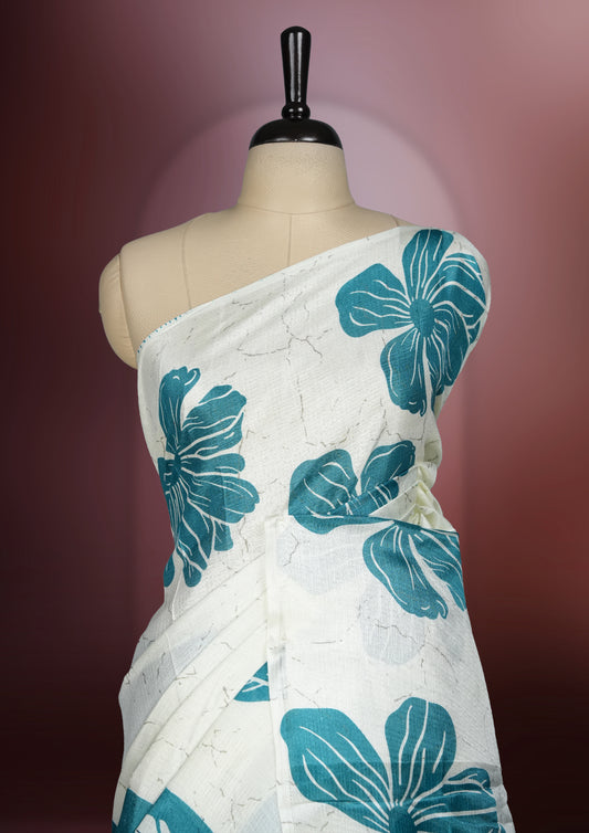 Sky blue colour saree with off white floral motifs and subtle , exuding timeless elegance and modern charm & paired with a matching blouse.