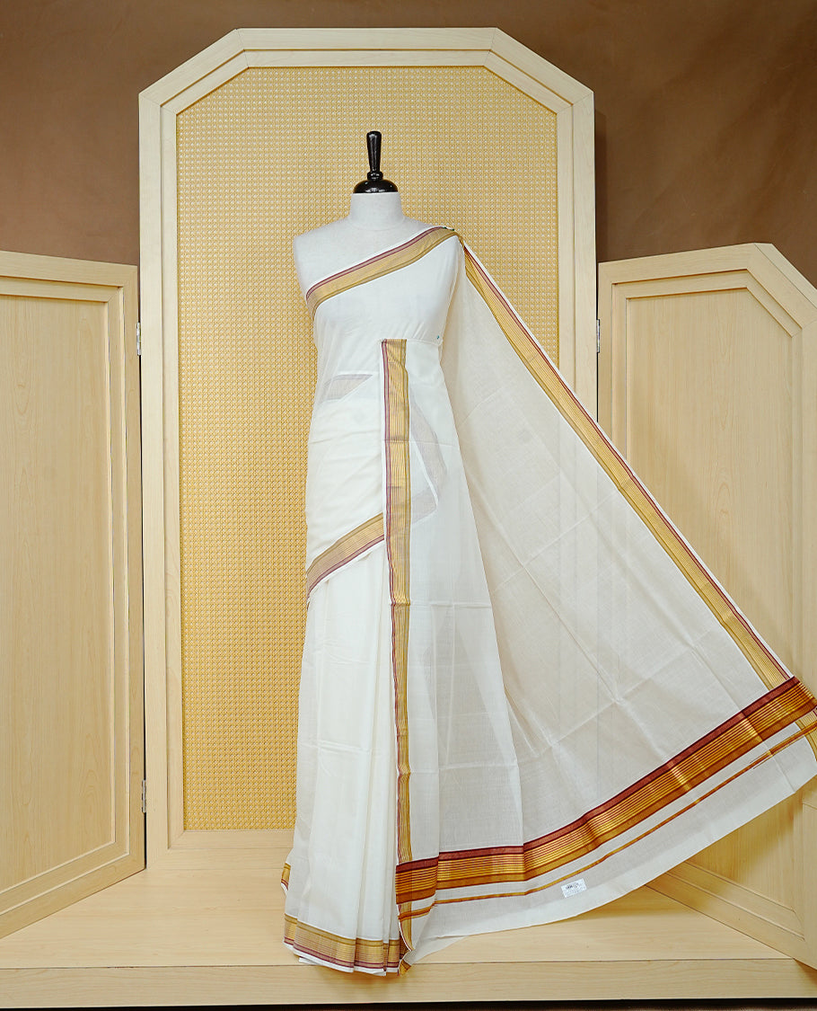 Cream Colour Cotton Kerala Saree Featuring a Plain Body, Enhanced with a Gold Zari and Maroon Border, Traditional Gold Zari Pallu, and a Matching Blouse Piece.