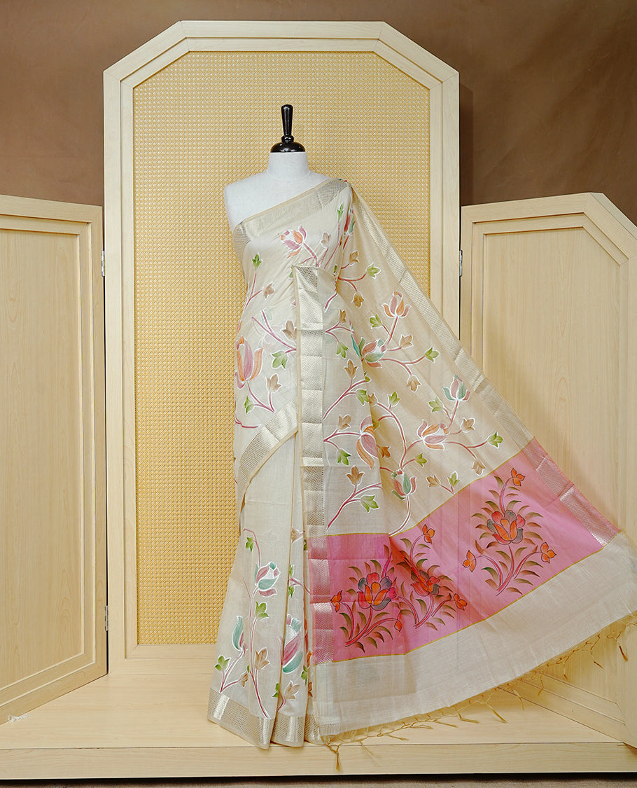 Cream Colour Tissue Kerala Saree Featuring Floral Kodi Threadwork Across The Body, Enhanced With A Light Gold Zari Border And A Pink Floral Pallu, Finished With Gold Tassels And A Matching Blouse Piece