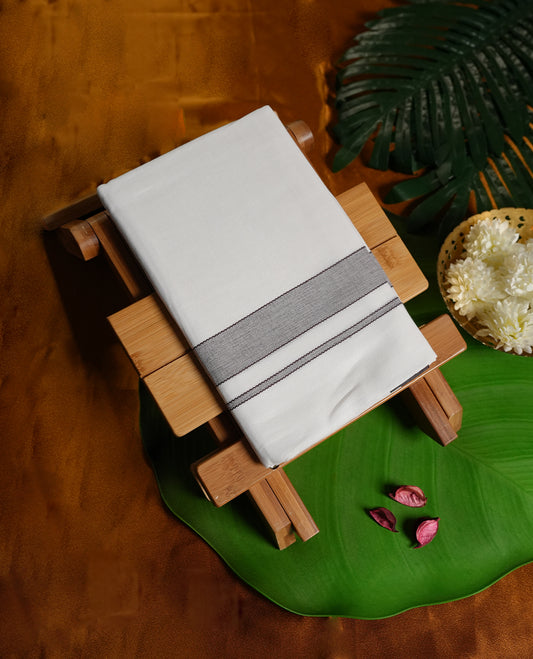 White colour cotton dhoti featuring a sleek dark navy blue border, designed with a classic weave for a refined traditional look  & Perfect for festive occasions, cultural ceremonies, and temple wear.