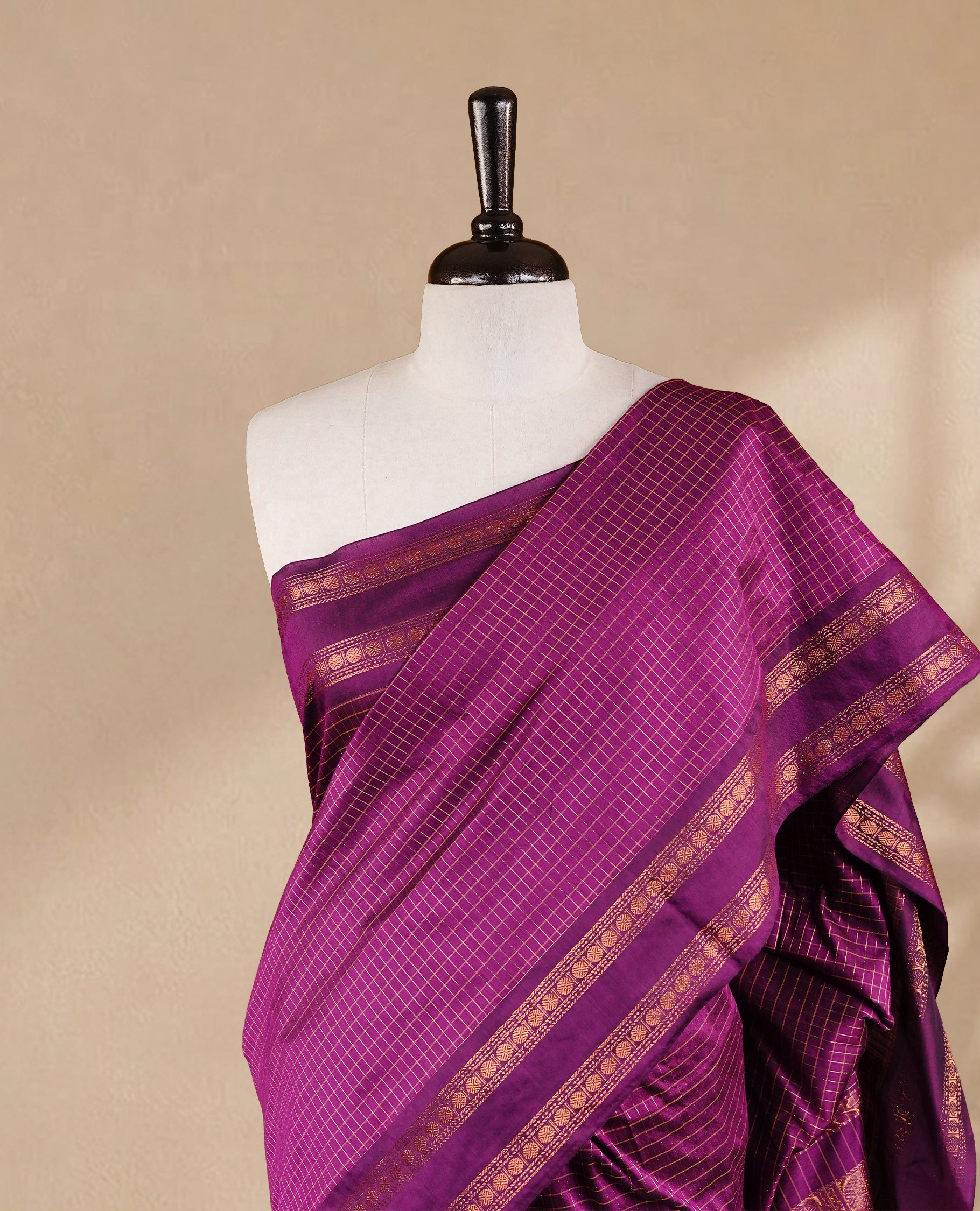 Grape colour kalyani cotton saree featuring gold zari Check pattern on body, complemented by self colour with Antique zari border, paired with matching blouse piece.