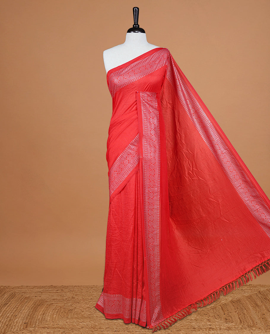 Red colour semi silk saree featuring Elegant plain body with fancy border, comes with matching self colour blouse piece.