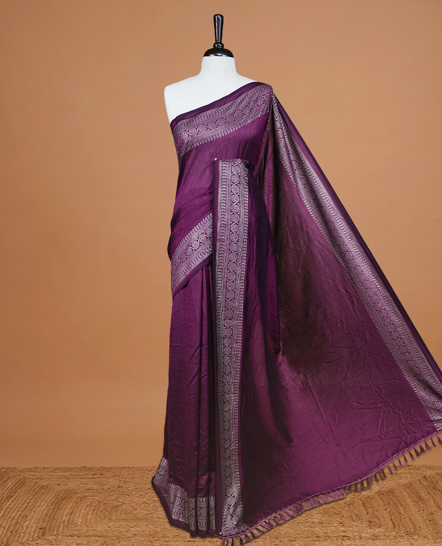 Purple colour semi silk saree featuring Elegant plain body with fancy border, comes with matching self colour blouse piece.