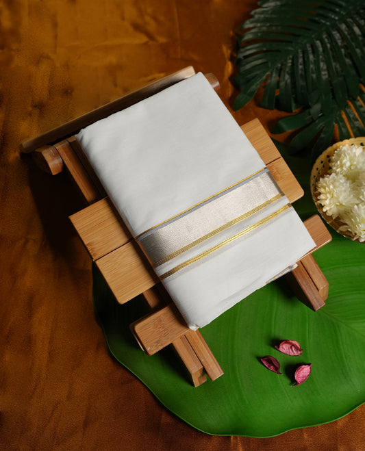 Off white colour pure cotton dhoti adorned with an elegant golden zari border and subtle silver detailing, giving it a rich and graceful finish & Ideal for weddings, festive occasions, and cultural ceremonies.