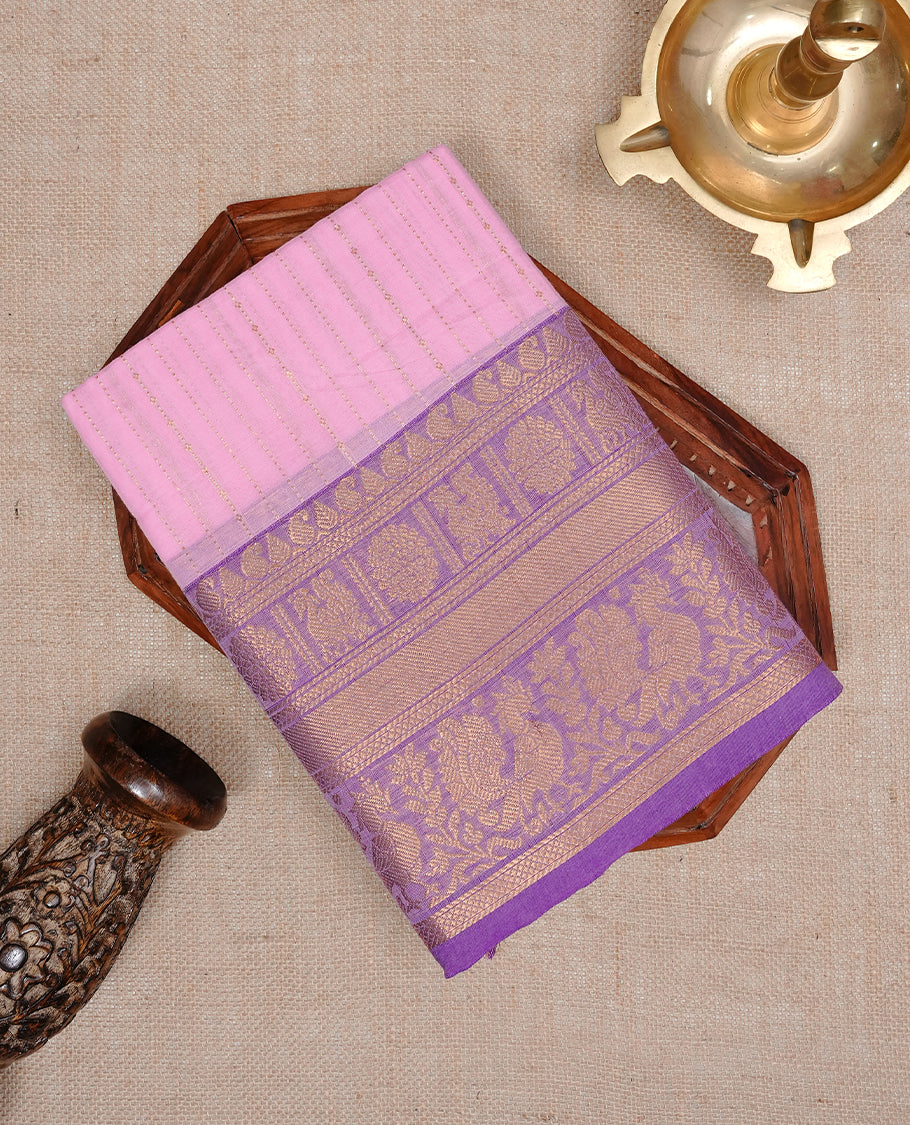 Pink colour chettinad cotton saree featuring  gold zari stripes on body, complemented by Purple border, paired with matching blouse piece.