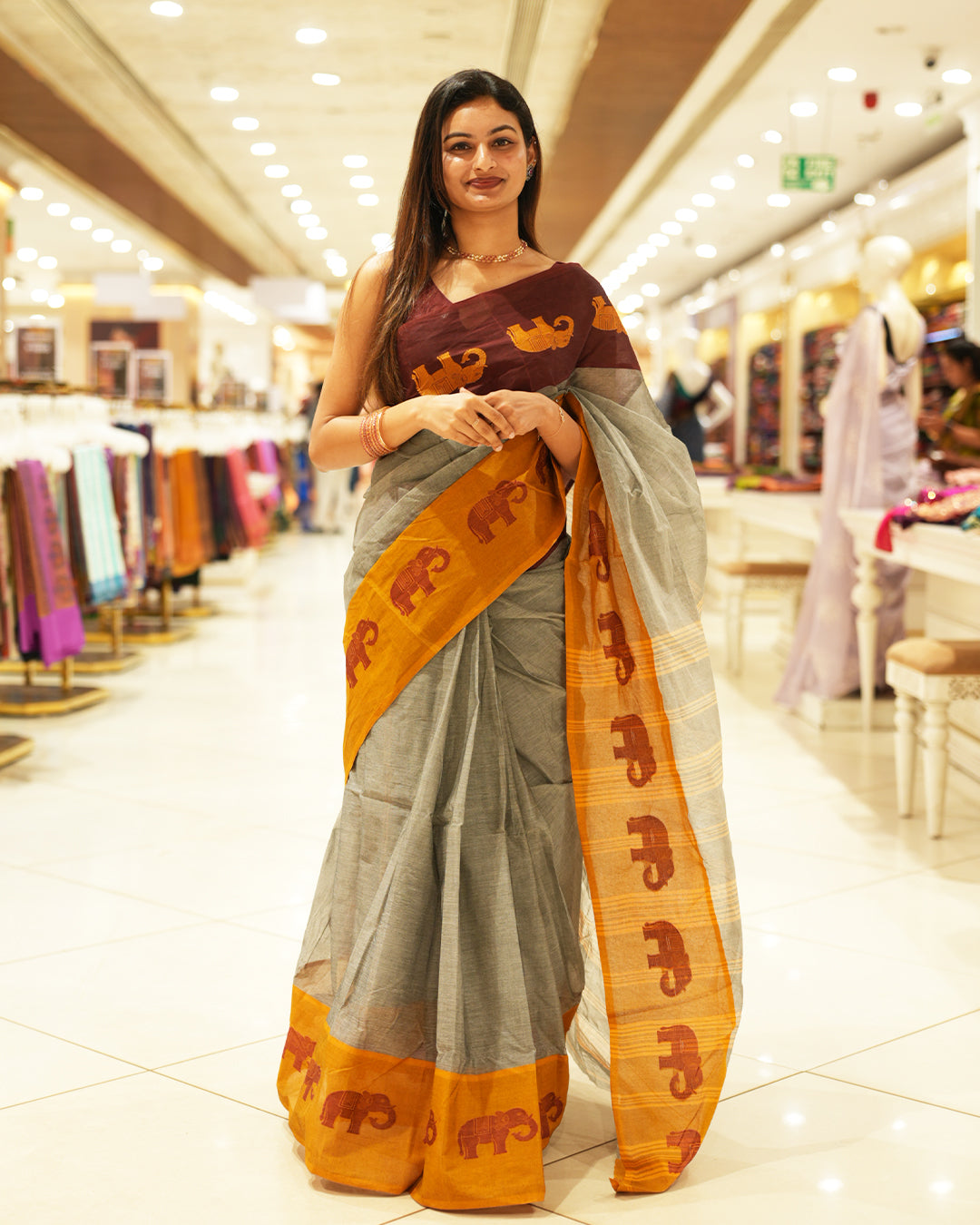 Mustard With Maroon Bengal cotton saree featuring Ganga Jamuna Style Contrast Border with elephant motifs, Striped pallu.